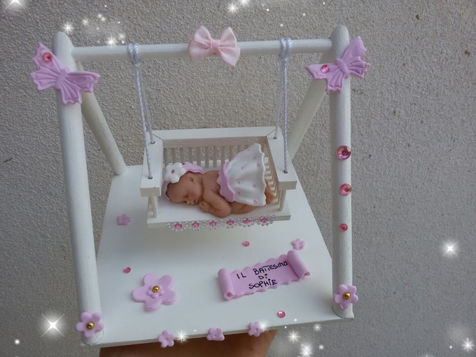 Altalena con bimba in fimo