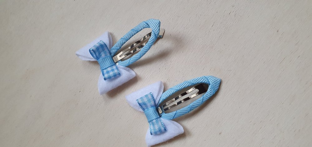 Coppia fermagli con fiocco 