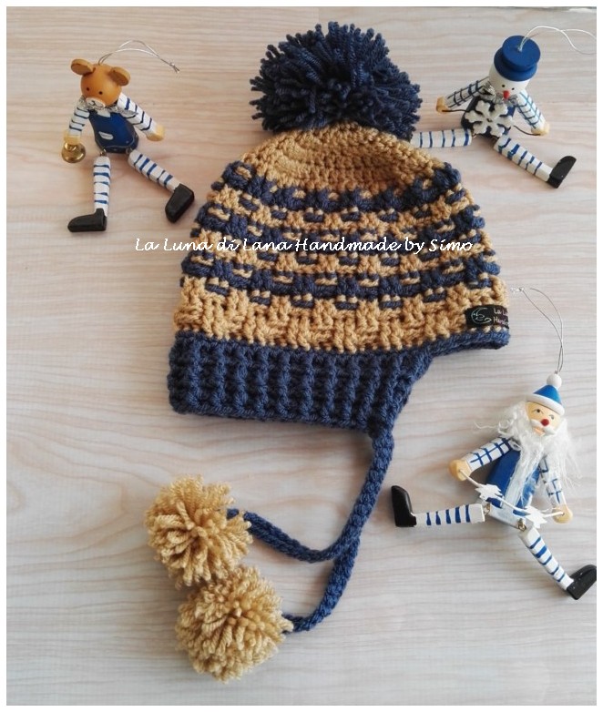 Cappellino per bambino o bambina ad uncinetto con pom pom e paraorecchi