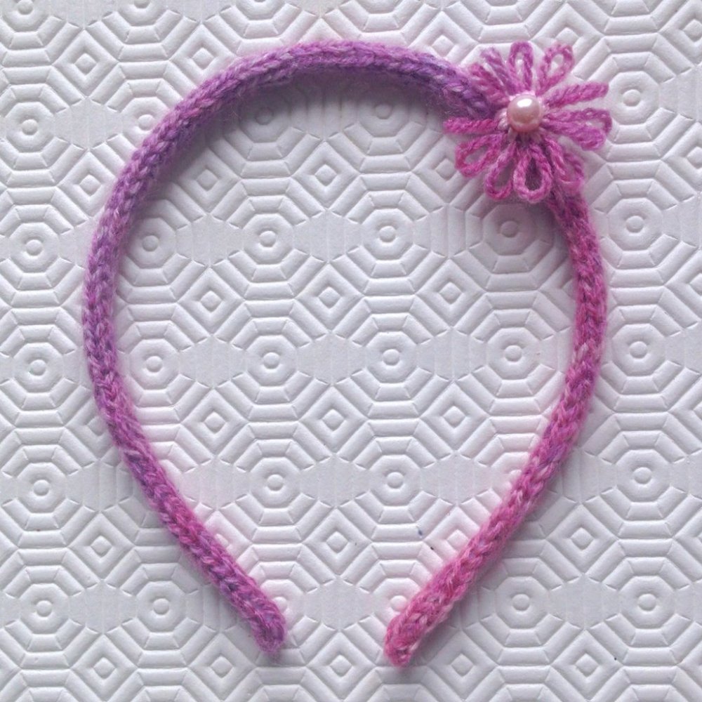 Cerchietto rosa mlange a tricotin con fiorellino