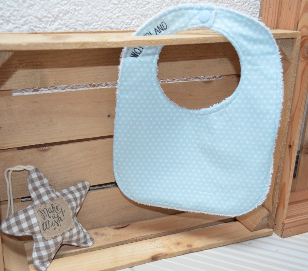 Bavaglino color azzurro chiaro con stelline bianche